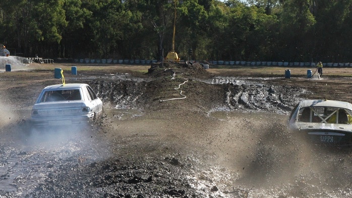 a car races through mud