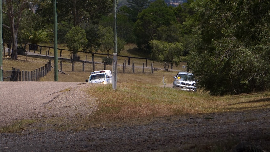 A police car and a damaged four-wheel drive on the side of a road new Newcastle