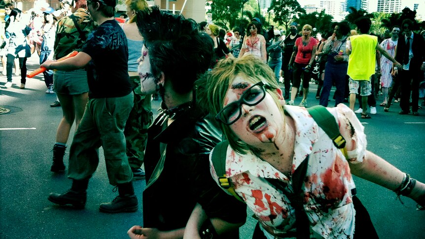 Participants in the 2011 Brisbane Zombie Walk lurch through the CBD