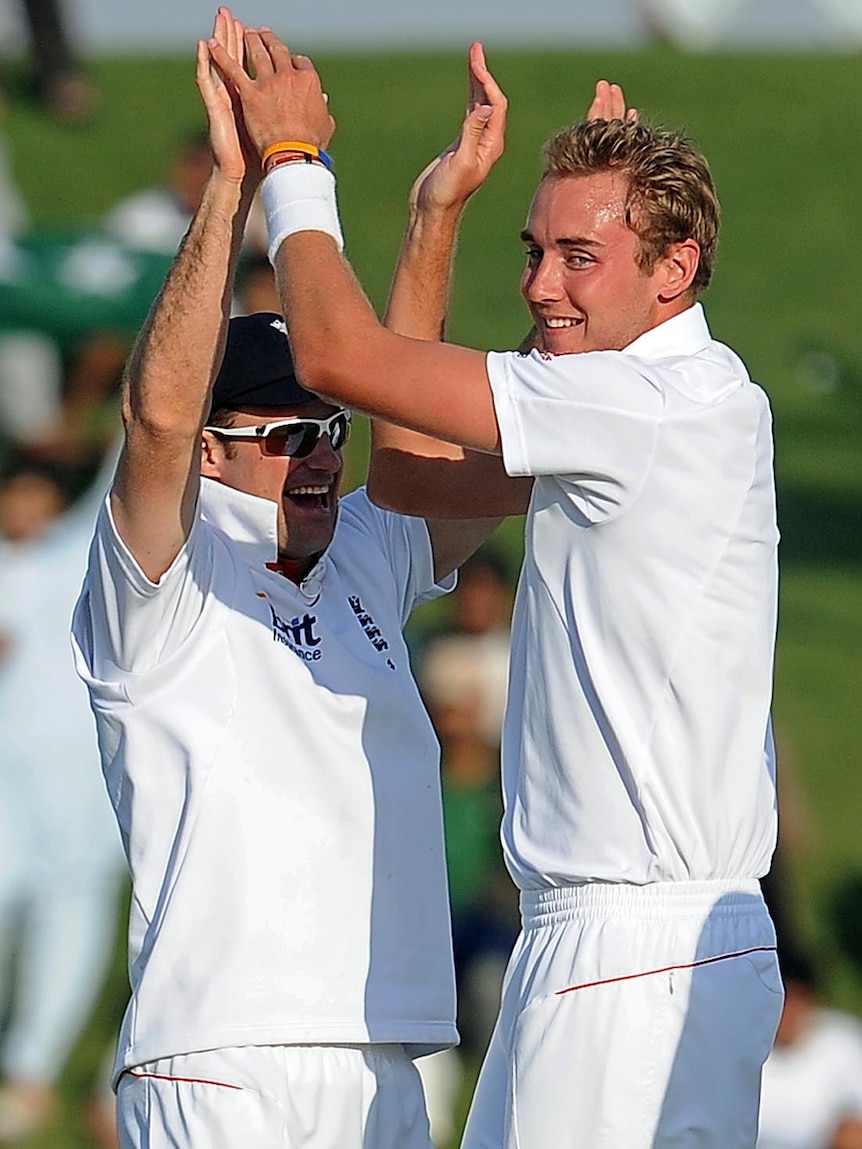 Stuart Broad celebrates with Andrew Strauss after dismissing Adnan Akmal.