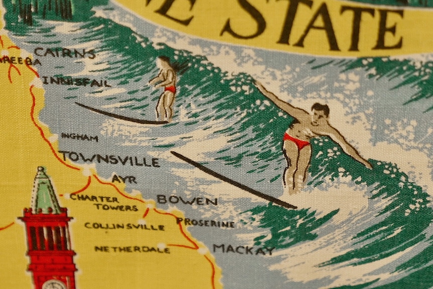 Surfers along the Queensland coast on a tea towel. 