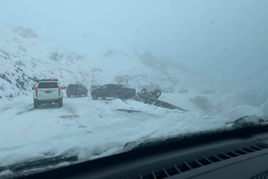 car towing trailer part off mountain 