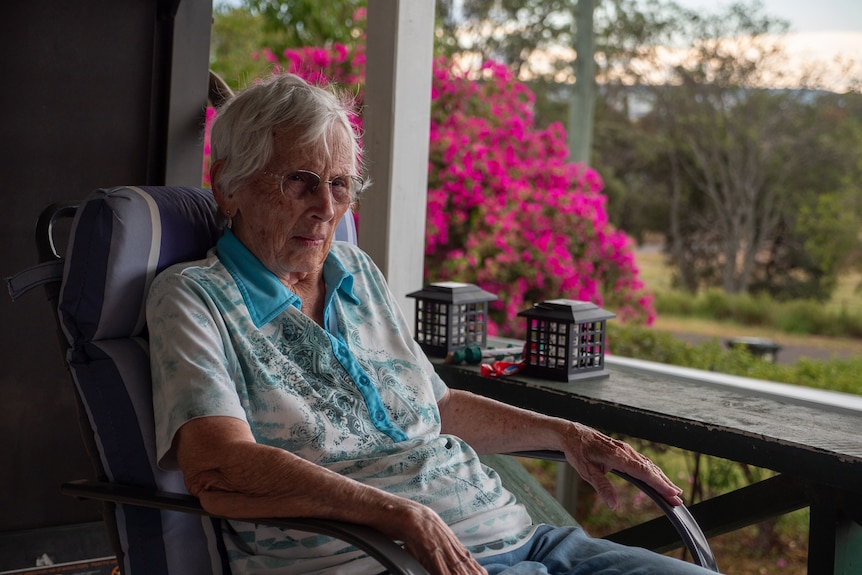 Myra Phipps sitting on her balcony in Taroom, Queensland, November 2021.