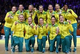 Australian netball team the Diamonds with their Birmingham Commonwealth Games gold medals.