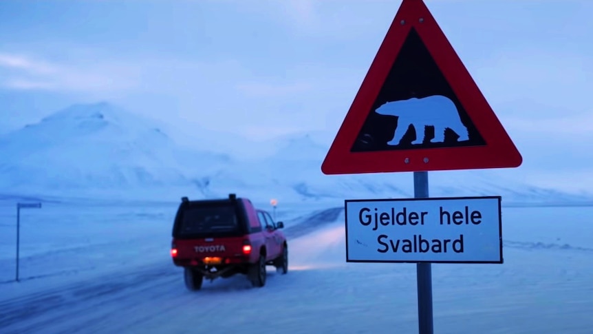 A sign warning of polar bears near the GitHub code vault in Svalbard.