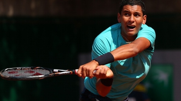 Nick Kyrgios hits a shot past Stepanek