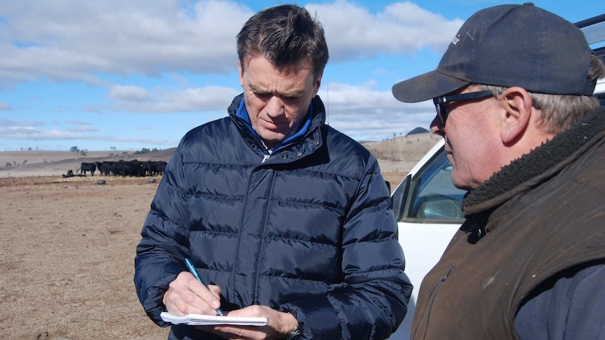 Michael Rowland speaks to farmer Sam White in Guyra, NSW.