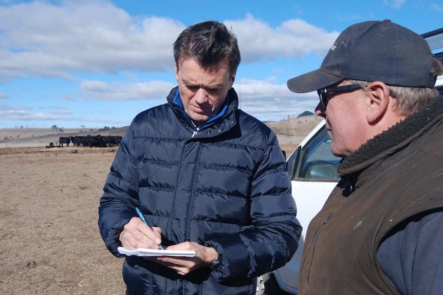 Michael Rowland speaks to farmer Sam White in Guyra, NSW.