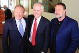 Andrew Forrest, Malcolm Turnbull and Russell Crowe (L-R) stand together for the cameras after a public presser