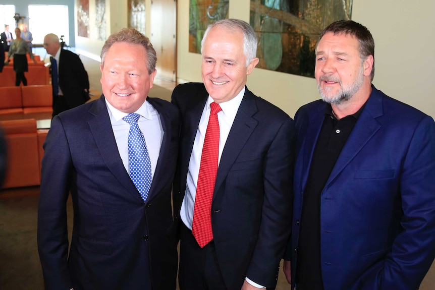 Andrew Forrest, Malcolm Turnbull and Russell Crowe (L-R) stand together for the cameras after a public presser