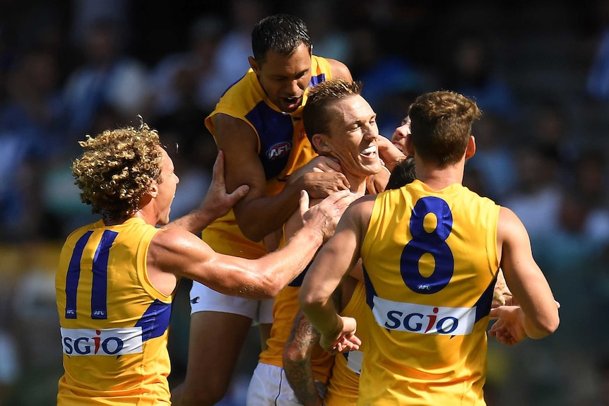 West Coast gets around Drew Petrie after his first goal