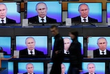 Putin on several TV screens