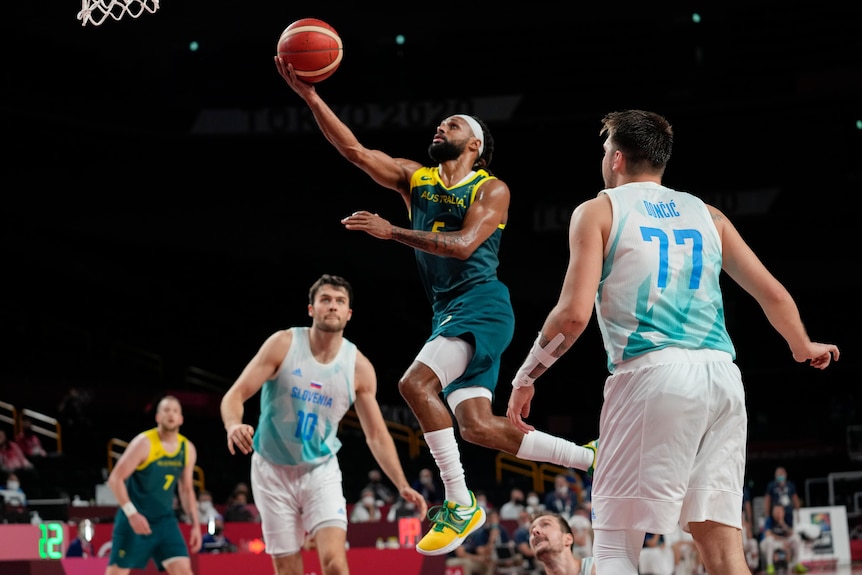 Patty Mills goes in for a lay-up in Australia's basketball bronze-medal game against Slovenia at the Tokyo Olympics.