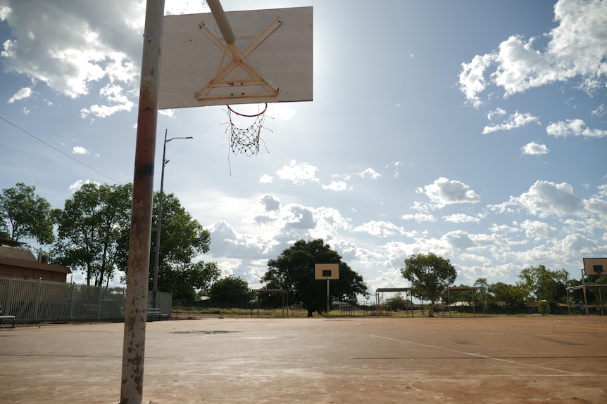 A rural basketball court on a sunny day
