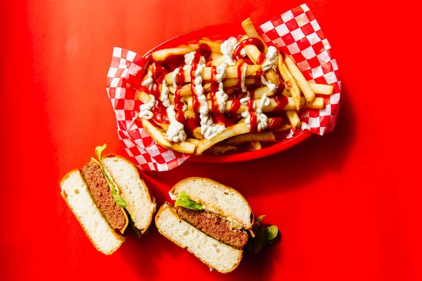 A plant-based burger with fries