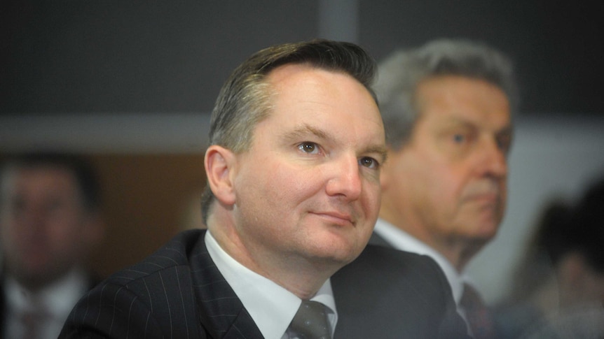 Federal Treasurer Chris Bowen listens at the National Press Club in Canberra.