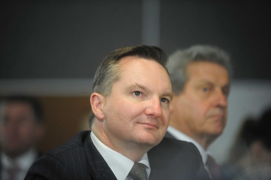 Federal Treasurer Chris Bowen listens at the National Press Club in Canberra.
