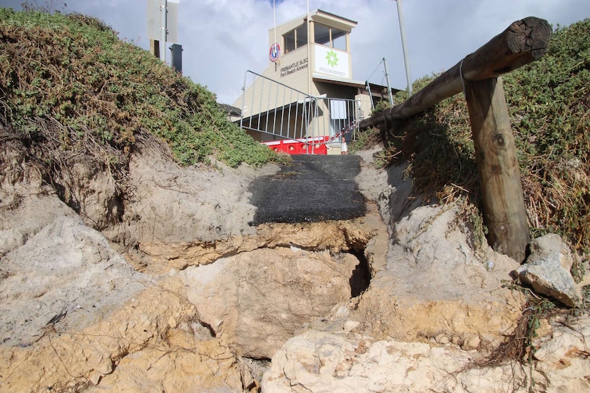 A close-up shot of a collapsed path leading from Fremantle's Port Beach up to a surf life saving club.