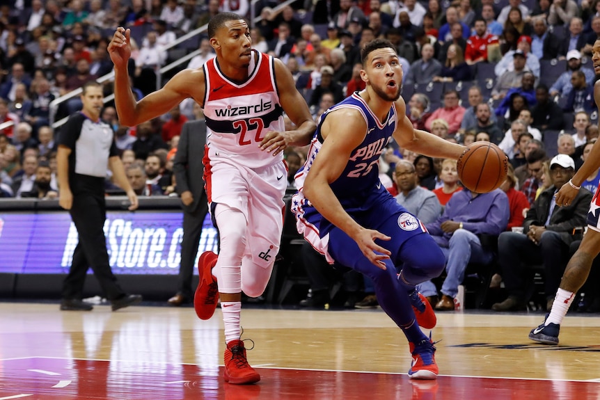 Ben Simmons drives to the basket against Washington Wizards.