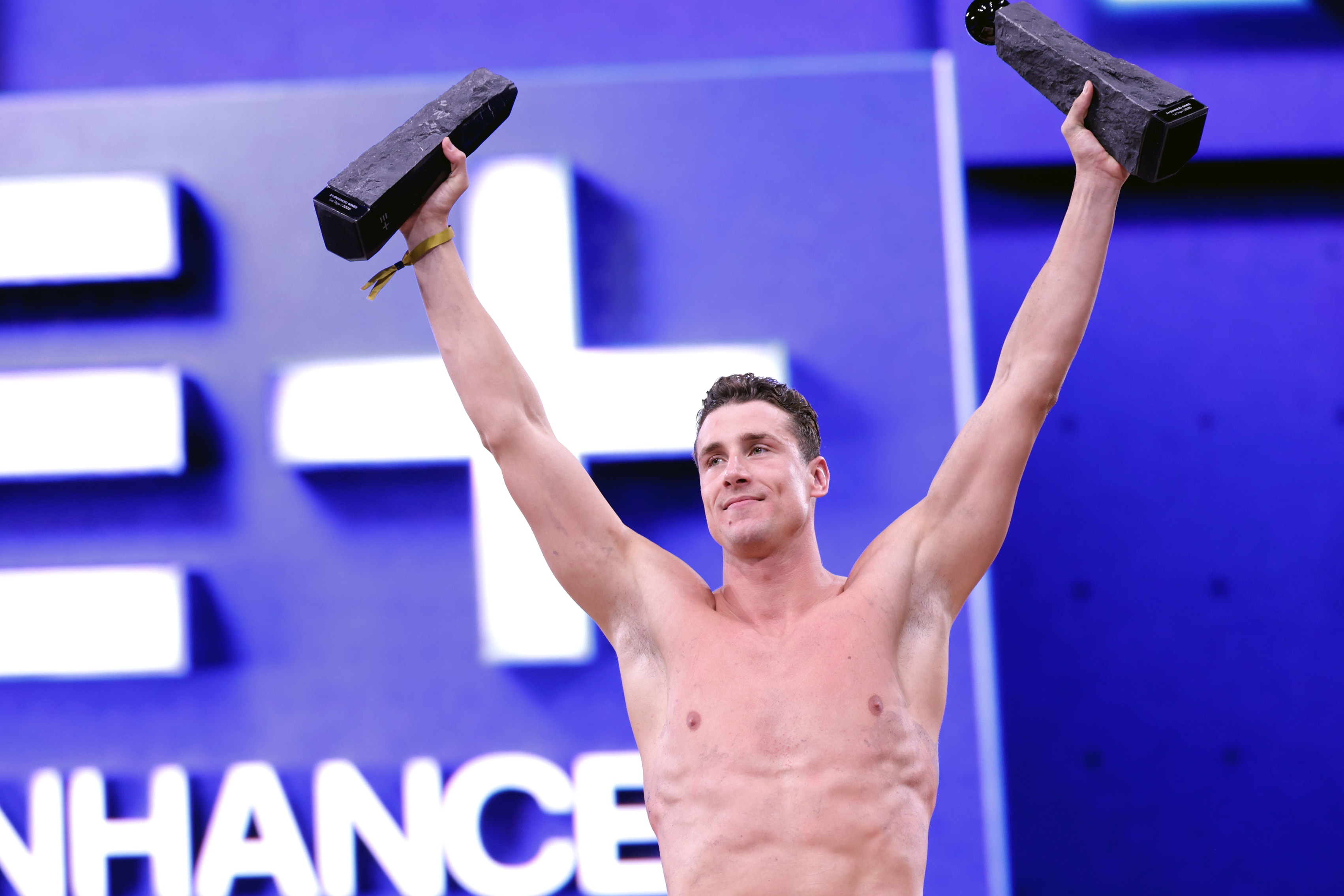 Kristian Gkolomeev,holds up two trophies