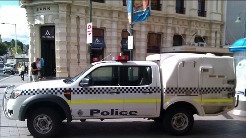 A dual-cab Tasmania police van parked on a Launceston CBD street.