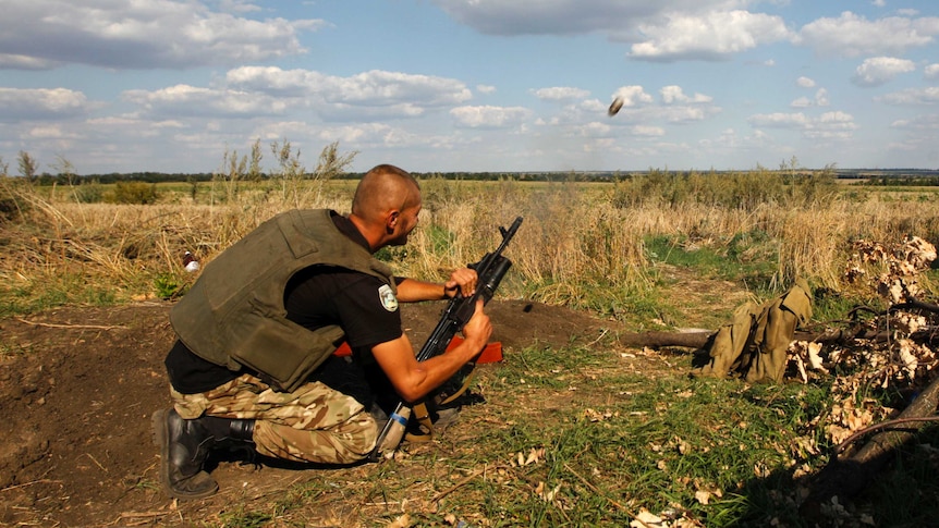 Ukrainian serviceman shooting a grenade