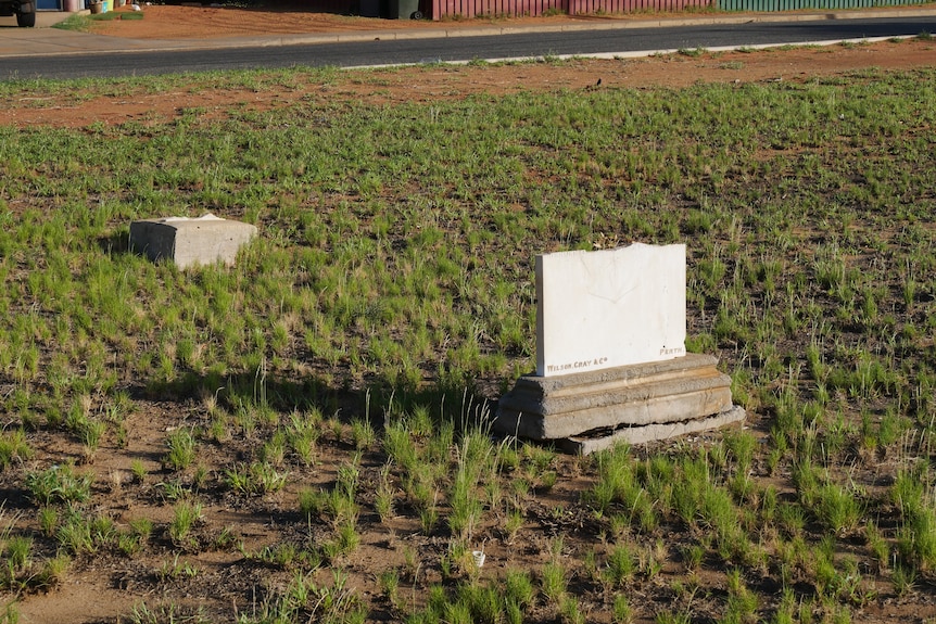 Graves against a desert backdrop, all showing visible signs of damage. Several are cracked or split in places.