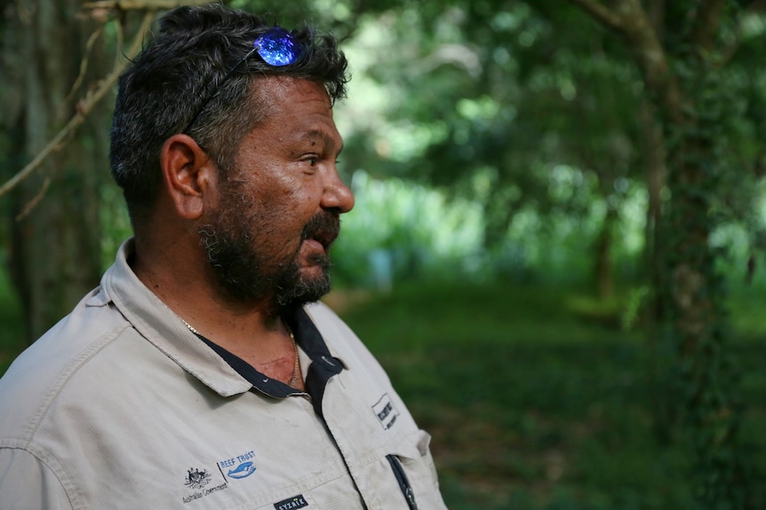 Portrait of Indigenous ranger in a rainforest landscape. 