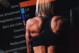 Composite image of woman in fitness gear at the gym with chart superimposed.