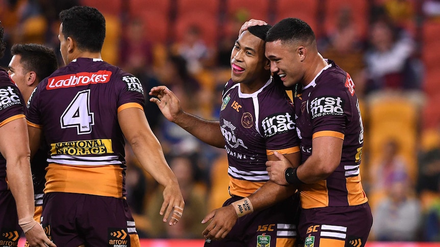 Jamayne Isaako of the Broncos (C) reacts after scoring a try against Parramatta.