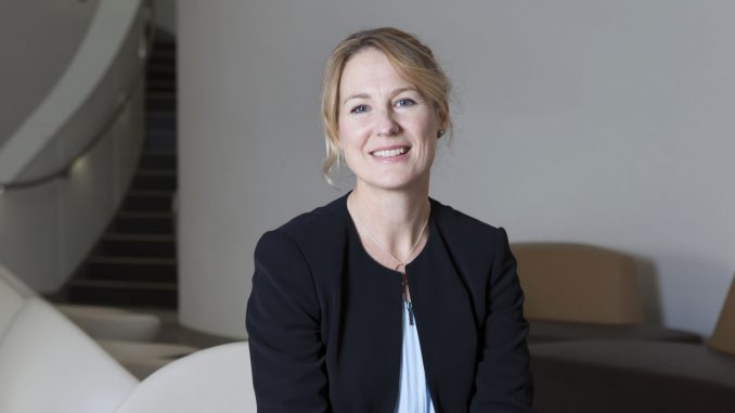 A woman smiles for the camera