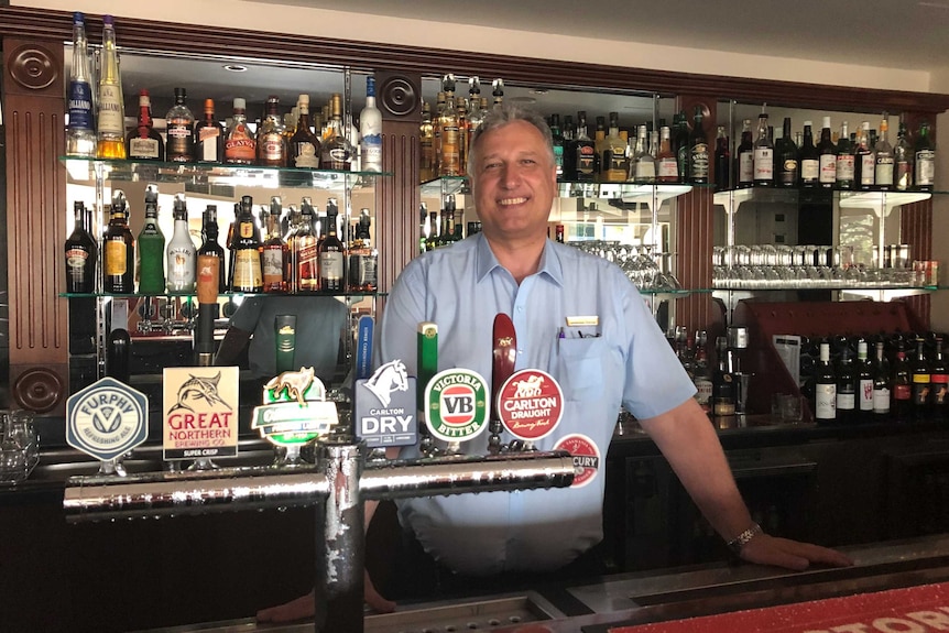 Nick Zurcas stands behind the bar.