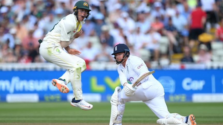 Marnus Labuschagne jumps up close to the pitch as Jonny Bairstow completes a sweep shot