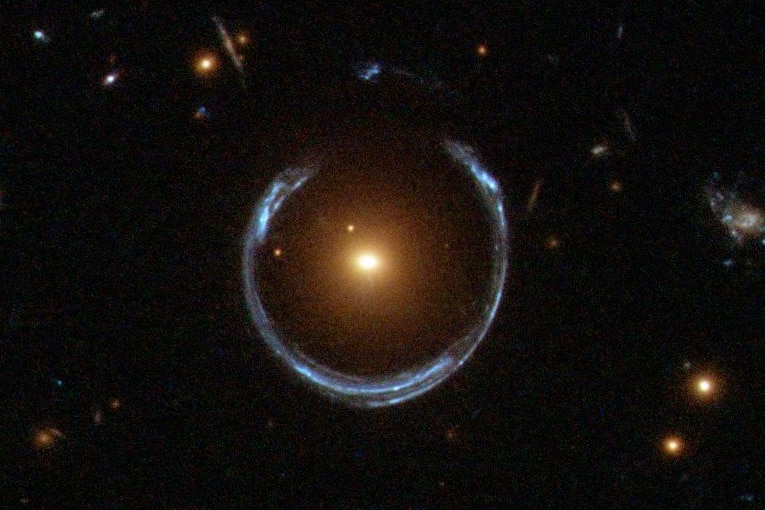 Hubble image of two gravitationally lensed galaxies called the Cosmic Horseshoe