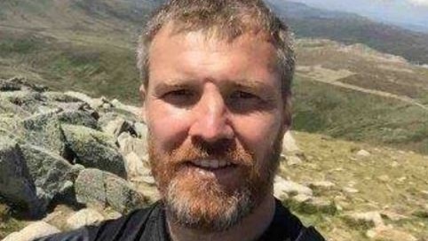 Gary Fahey takes a selfie while hiking.