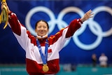 Chinese skater Yang Yang winning the first winter Olympics gold medal for China at Salt Lake City in 2002.