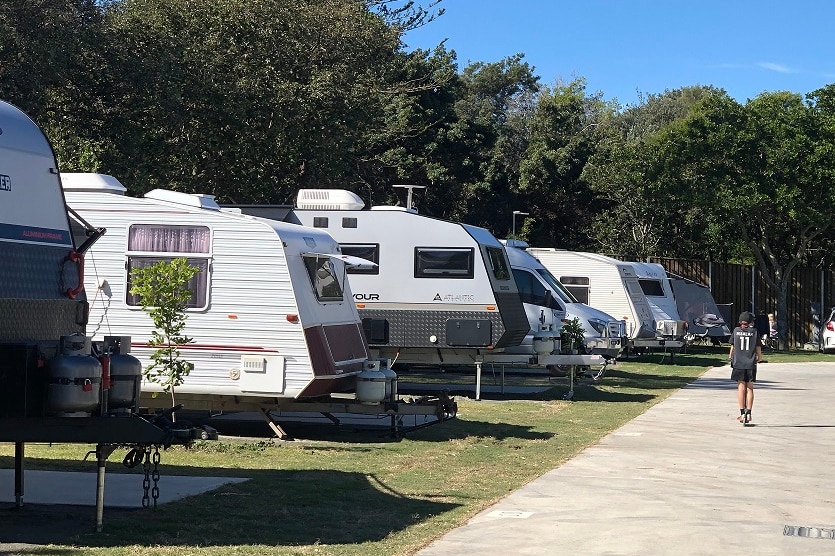 A row of caravans at a holiday park.