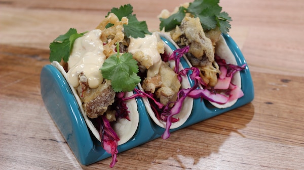 TEMPURA MUSHROOM TACOS WITH PURPLE SLAW finished dish in serving holders on bench.