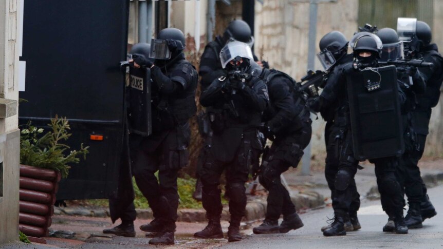French special intervention police conduct a house-to-house search