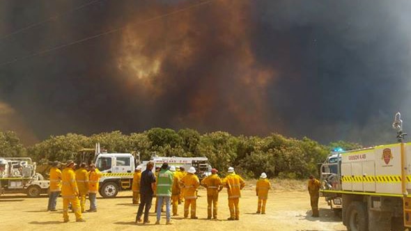 Firefighters view a bushfire burning near Esperance in WA 18 November 2015