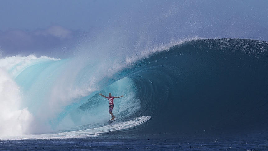 Kelly Slater scoring an epic Fijian barrel