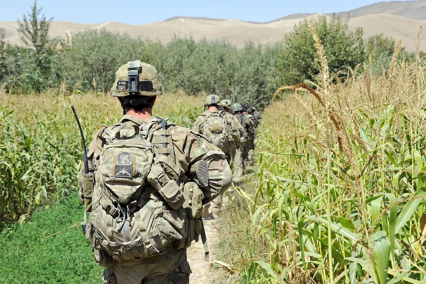 Australian soldiers patrol with Afghan National Army soldiers in Mirabad Valley.