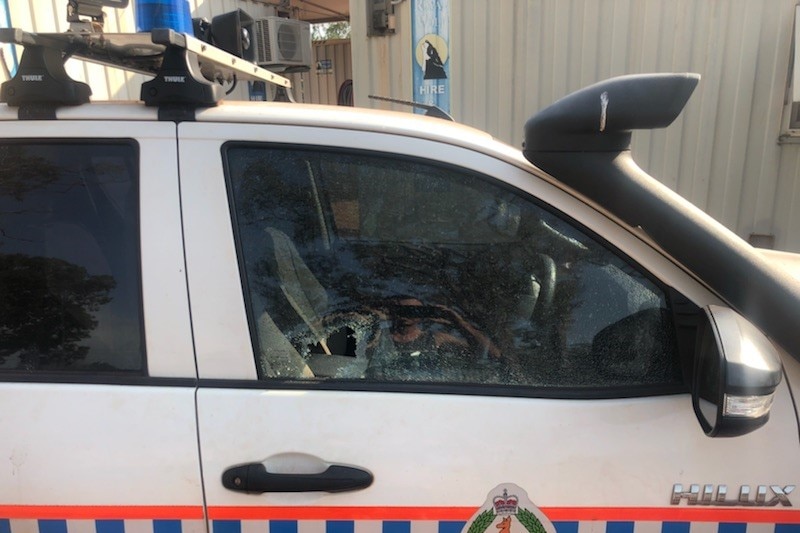 A police car with a broken window.