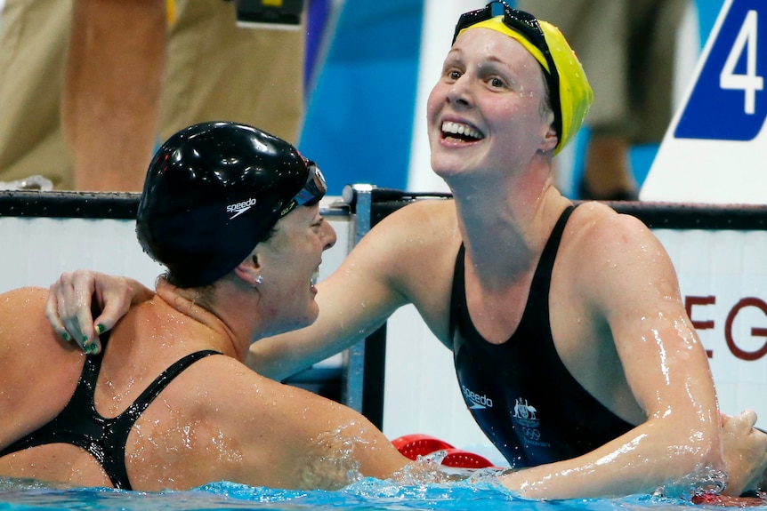 LtoR Allison Schmitt is congratulated by Bronte Barratt after winning the 200m freestyle final.