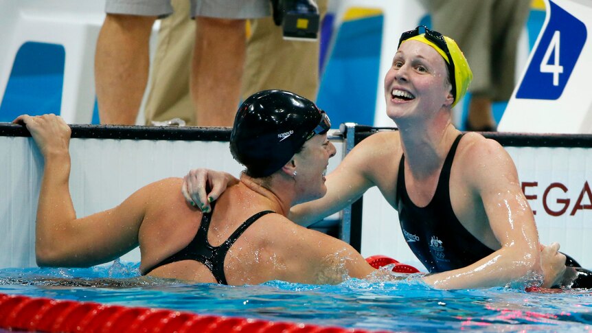 LtoR Allison Schmitt is congratulated by Bronte Barratt after winning the 200m freestyle final.
