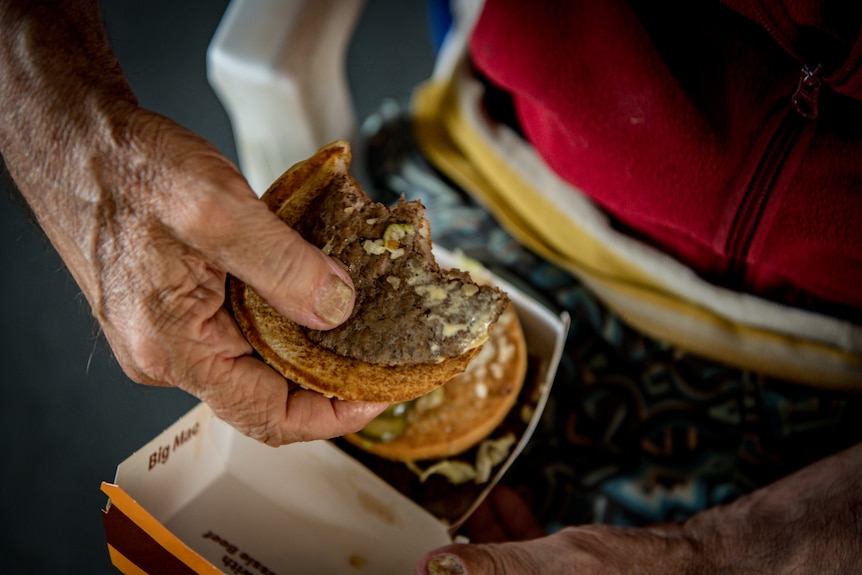 Peter Ristic holds a McDonalds burger