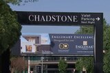 A large sign above a road says 'CHADSTONE'.