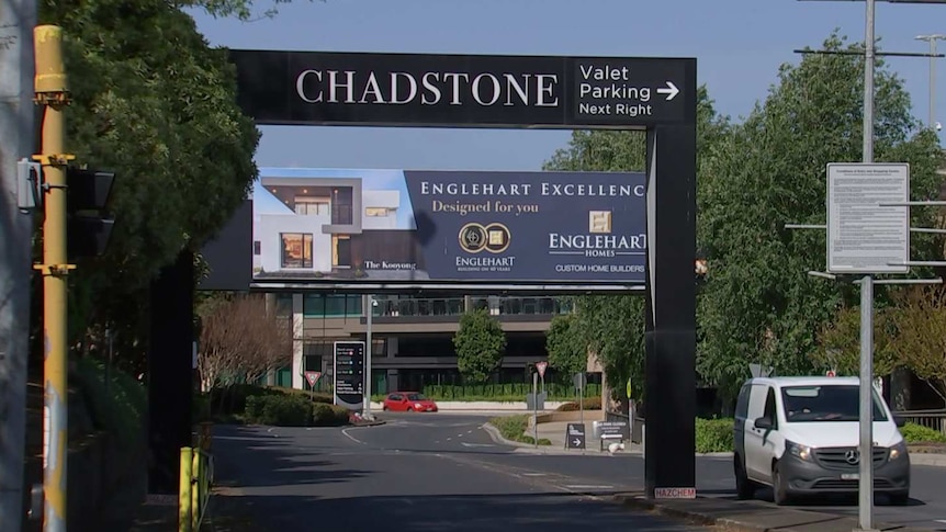 A large sign above a road says 'CHADSTONE'.