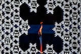 The Olympic flame is seen in the middle of a giant snowflake during the opening ceremony. 
