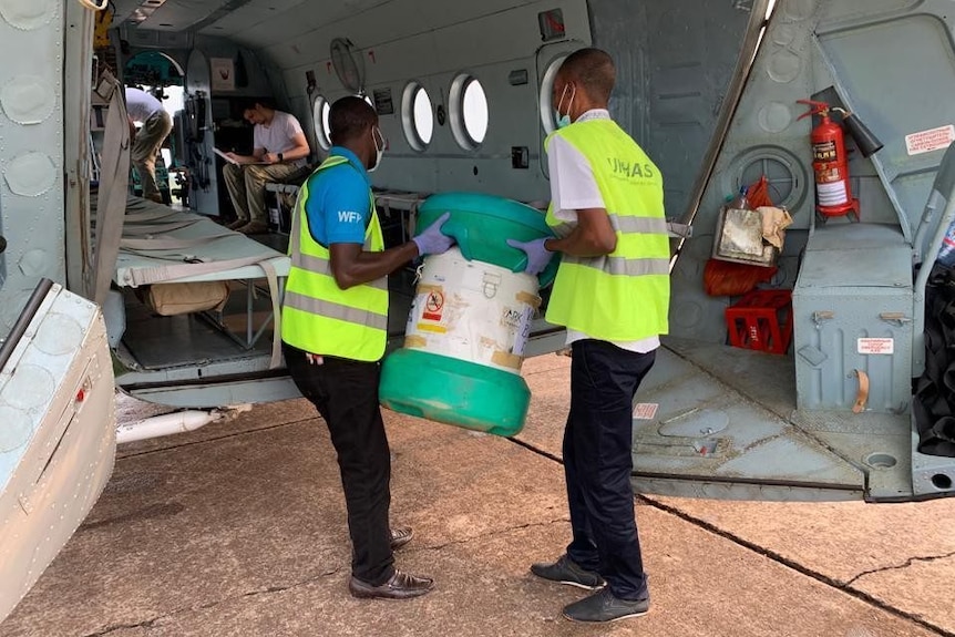 An Arktek device being loaded aboard a military plane